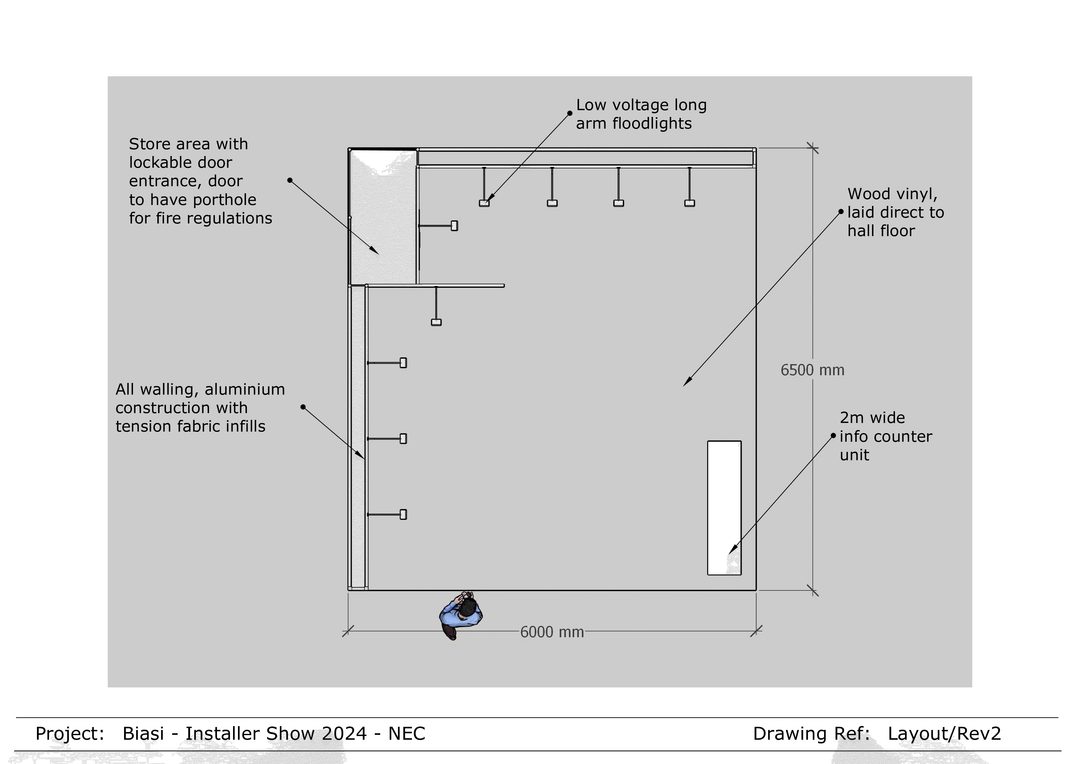 grey drawing plan for the installer show. square outline of the floor plan in black with arrows pointing to specific parts which are labelled. Store area with lockable door entrance, door to have porthole for fire regulations. All walling is aluminium construction with tension fabric infills. low voltage long arm floodlights. wood vinyl, laid direct to hall floor. 2m wide info counter unit. figure of a man stands at the bottom of the square