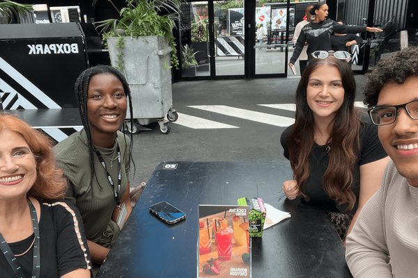Claire and Michaela (left) and Emma and Jamie (right) sitting at table in Boxpark