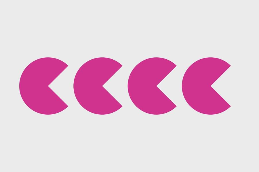 Four shapes that are pink and resemble the PACMAN character.