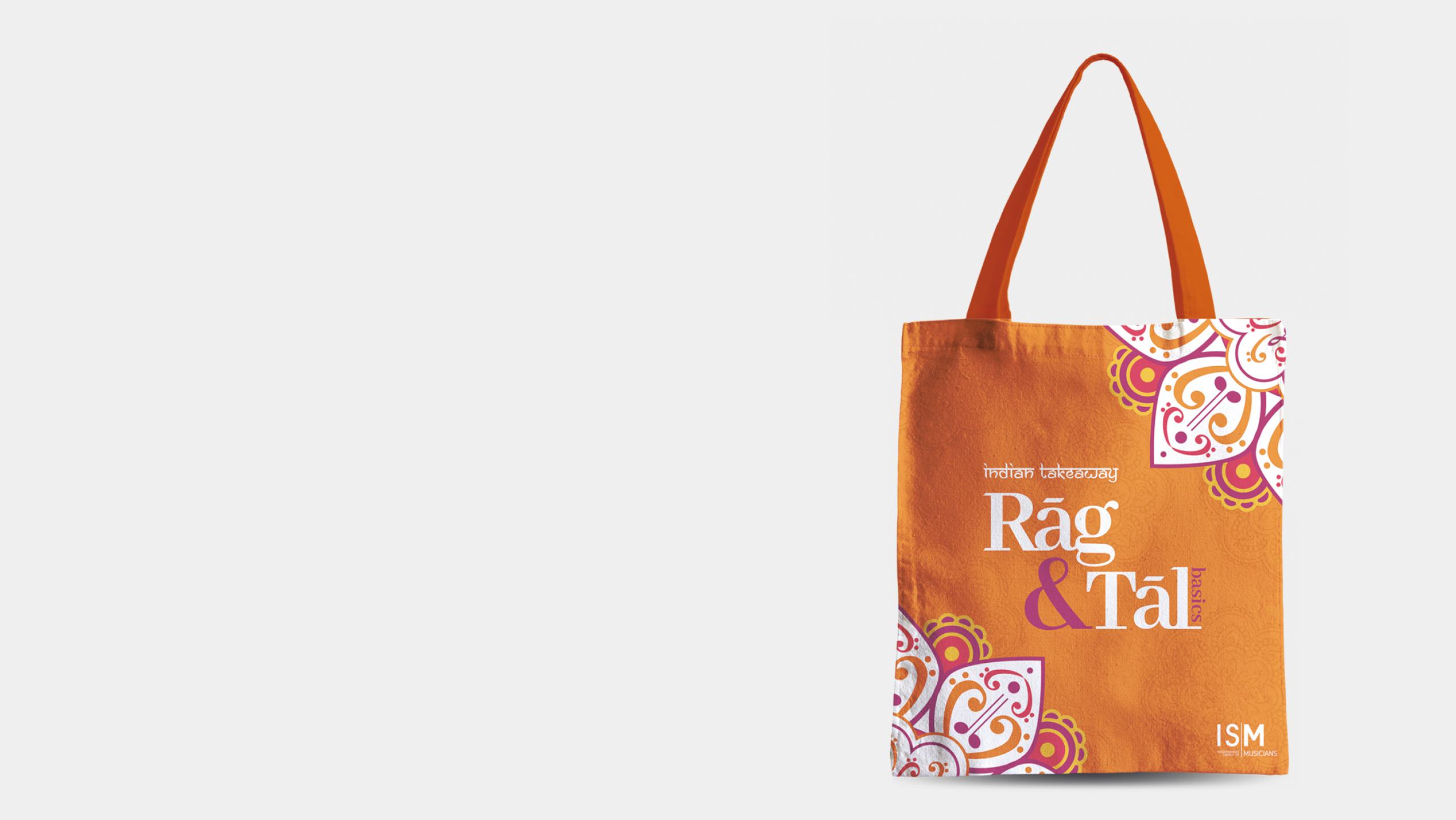 Mockup of orange tote bag with Rag and Tal logo on the front.