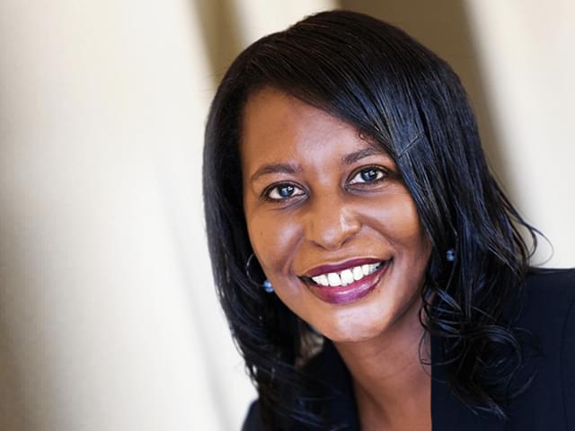 A headshot of Monica Beckles. She is smiling.